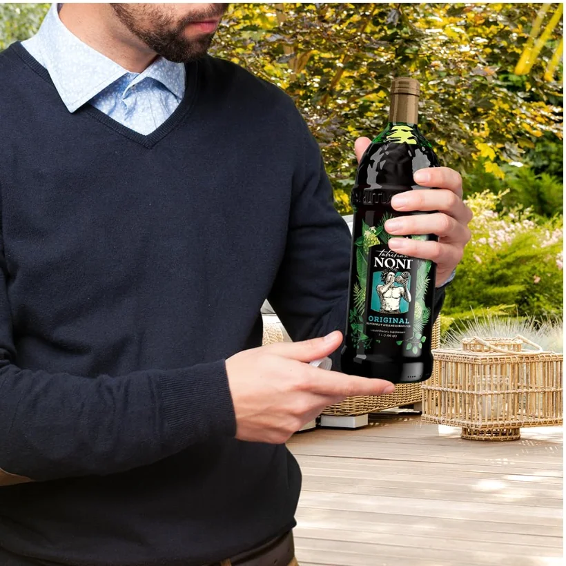 Held in one hand, label out. The bottle is 1 litre and heavier than it looks in a photograph.